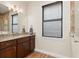 Bathroom with granite vanity, tile floor and window with blinds at 3937 Bal Harbor Blvd, Punta Gorda, FL 33950