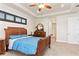 Bright bedroom with a large bed and access to the bathroom at 3937 Bal Harbor Blvd, Punta Gorda, FL 33950