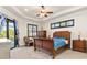 Spacious main bedroom with a ceiling fan and sliding doors to the pool at 3937 Bal Harbor Blvd, Punta Gorda, FL 33950