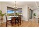 Bright dining area with a table for four and large window overlooking the golf course at 3937 Bal Harbor Blvd, Punta Gorda, FL 33950