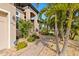 Landscaped front yard with palm trees and a brick pathway leading to the house entrance at 3937 Bal Harbor Blvd, Punta Gorda, FL 33950