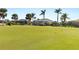 View of a lush green golf course from the backyard at 3937 Bal Harbor Blvd, Punta Gorda, FL 33950