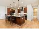 Spacious kitchen featuring granite countertops and dark wood cabinetry at 3937 Bal Harbor Blvd, Punta Gorda, FL 33950