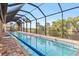 Enclosed lap pool with screened enclosure and brick pavers at 3937 Bal Harbor Blvd, Punta Gorda, FL 33950