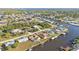 Aerial view highlighting a waterfront house with dock and neighborhood context at 4107 Rock Creek Dr, Port Charlotte, FL 33948