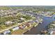 Aerial view of a canal-front home, showcasing the property and neighborhood at 4107 Rock Creek Dr, Port Charlotte, FL 33948