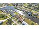 Aerial showcasing waterfront home, neighborhood and canal at 4107 Rock Creek Dr, Port Charlotte, FL 33948