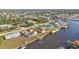 Aerial view showing a waterfront home with canal access and surrounding properties at 4107 Rock Creek Dr, Port Charlotte, FL 33948