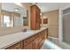 Double vanity bathroom with wood cabinets and shower at 4107 Rock Creek Dr, Port Charlotte, FL 33948