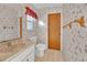 Clean bathroom with floral wallpaper and tiled floor at 4107 Rock Creek Dr, Port Charlotte, FL 33948