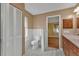 Bathroom with toilet, shower, and linen closet at 4107 Rock Creek Dr, Port Charlotte, FL 33948