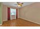 Bedroom with hardwood floors and large window at 4107 Rock Creek Dr, Port Charlotte, FL 33948