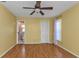 Spacious bedroom with wood floors, ceiling fan and en-suite bathroom at 4107 Rock Creek Dr, Port Charlotte, FL 33948