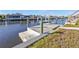 Wooden dock provides water access at 4107 Rock Creek Dr, Port Charlotte, FL 33948