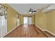 Sunlit living room featuring wood flooring and sliding doors at 4107 Rock Creek Dr, Port Charlotte, FL 33948