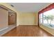 Living room with hardwood floors and large window at 4107 Rock Creek Dr, Port Charlotte, FL 33948