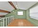 Bright loft area featuring wood flooring and exposed beams at 4107 Rock Creek Dr, Port Charlotte, FL 33948