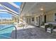 Covered patio with seating overlooking the pool at 4107 Rock Creek Dr, Port Charlotte, FL 33948