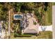 An aerial shot of a home with a pool and a fenced-in backyard at 4198 Kinlock St, North Port, FL 34286