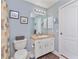 Bathroom with shower, toilet, and vanity with light fixtures at 4198 Kinlock St, North Port, FL 34286