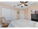 Spacious bedroom with double closets and rocking chair at 4198 Kinlock St, North Port, FL 34286