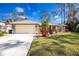 House exterior showcasing a two-car garage and manicured lawn at 4198 Kinlock St, North Port, FL 34286