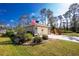 Front view of house with American flag and well-maintained lawn at 4198 Kinlock St, North Port, FL 34286