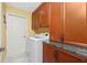 Laundry room with washer, dryer, and extra storage cabinets at 4198 Kinlock St, North Port, FL 34286