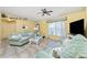 Bright living room with tiled floors and a ceiling fan at 4198 Kinlock St, North Port, FL 34286