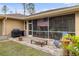 Brick patio with seating area and fire pit at 4258 Mermell Cir, North Port, FL 34291