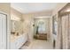 Clean bathroom with double vanity and walk-in shower at 4258 Mermell Cir, North Port, FL 34291