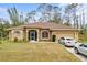 One-story home with a screened porch and two-car garage at 4258 Mermell Cir, North Port, FL 34291