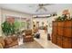 Living room with a view into Gathering room and access to the backyard at 4258 Mermell Cir, North Port, FL 34291