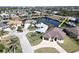 Aerial view of single-Gathering home on canal with paved driveway at 432 Gun Cay Ln, Punta Gorda, FL 33950