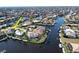 Aerial view of waterfront home with private dock and pool at 432 Gun Cay Ln, Punta Gorda, FL 33950