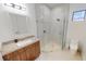 Modern bathroom with a large shower and granite vanity at 432 Gun Cay Ln, Punta Gorda, FL 33950