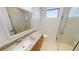 Clean bathroom with a single vanity, toilet, and walk-in shower at 432 Gun Cay Ln, Punta Gorda, FL 33950