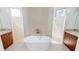 Luxurious bathroom featuring a freestanding tub and mosaic tile accents at 432 Gun Cay Ln, Punta Gorda, FL 33950