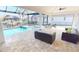 Relaxing pool area with patio furniture and a spa at 432 Gun Cay Ln, Punta Gorda, FL 33950