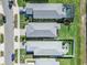 Aerial view of houses, showing gray roofs, and neatly landscaped backyards at 43783 Cattleman Dr, Punta Gorda, FL 33982