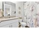 Small bathroom with white vanity and marble shower curtain at 43783 Cattleman Dr, Punta Gorda, FL 33982