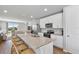 Modern kitchen featuring white cabinets, granite island, and stainless steel appliances at 43783 Cattleman Dr, Punta Gorda, FL 33982