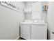 Laundry room with washer, dryer, and shelf at 43783 Cattleman Dr, Punta Gorda, FL 33982