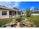 Peaceful backyard featuring a pond, waterfall, and screened porch at 4401 Boeing Ln, North Port, FL 34287