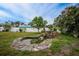 Charming backyard oasis with pond, fountain, and lush landscaping at 4401 Boeing Ln, North Port, FL 34287