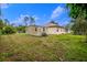 Large backyard with storage shed and grassy area at 4401 Boeing Ln, North Port, FL 34287