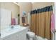 Clean bathroom with shower/tub, vanity, and linen storage at 4401 Boeing Ln, North Port, FL 34287