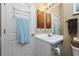 Bathroom with vanity, toilet, and a towel rack at 4401 Boeing Ln, North Port, FL 34287