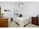 Cozy bedroom with striped bedding and wood furniture at 4401 Boeing Ln, North Port, FL 34287