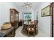 Dining room with wooden table and chairs, plus a china cabinet at 4401 Boeing Ln, North Port, FL 34287